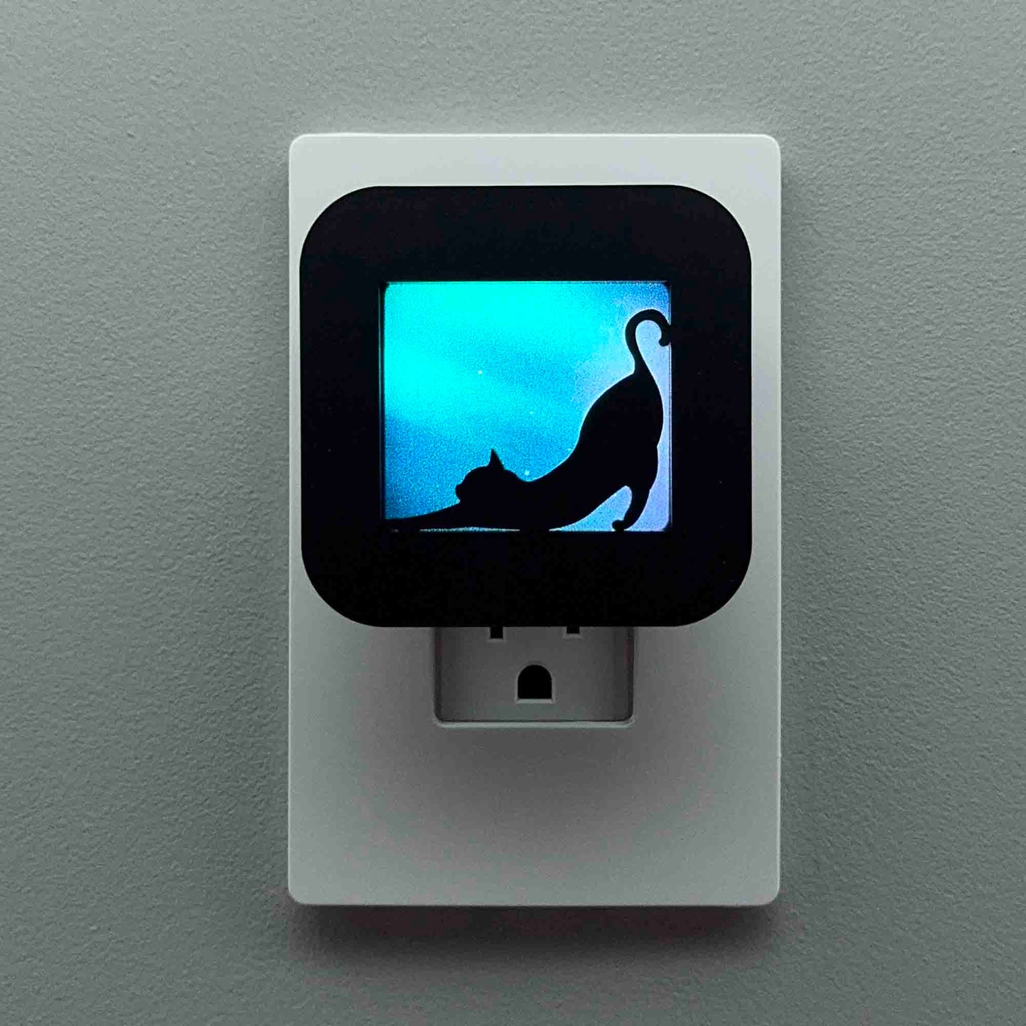 Stretching Cat Night Light with Northern Lights Background